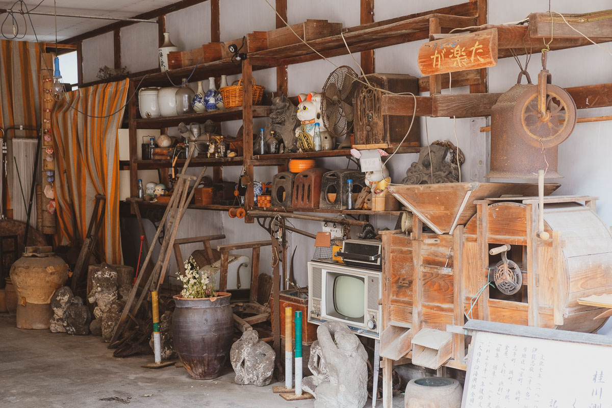 Retro and old wooden items on shelves in a Japanese garage in Showa no Machi shopping street, in Oita prefecture.