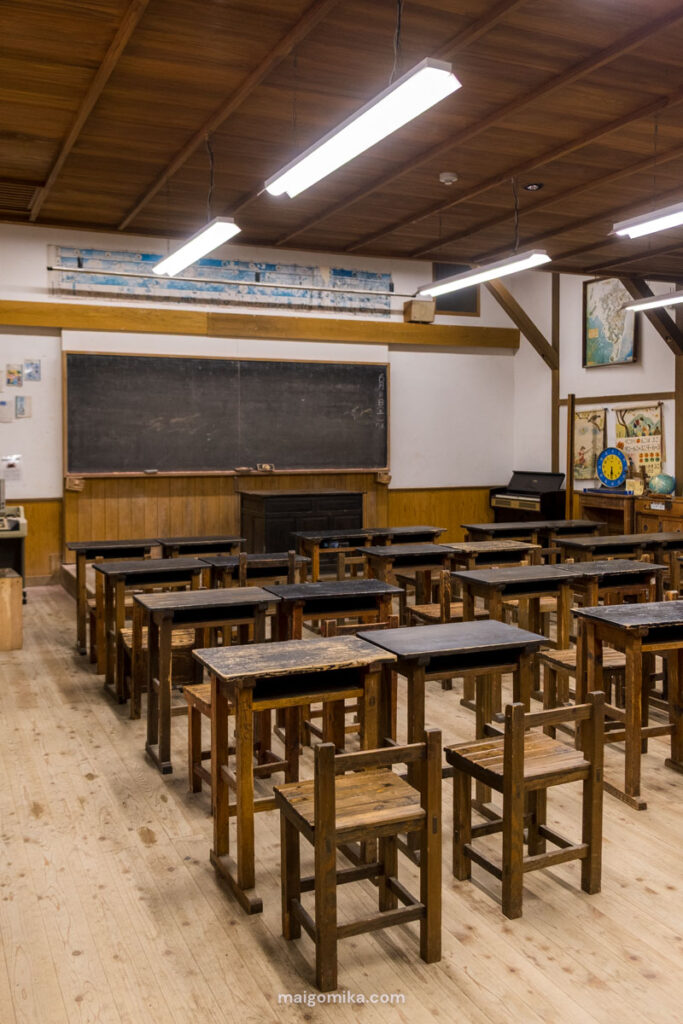 Retro Japanese classroom with wood chairs and a blackboard, in a Showa themed museum, in Showa no Machi, Oita prefecture.