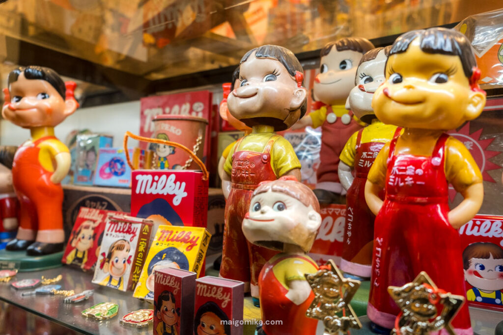 Interior of Dagashiya Dream Museum with collection of Showa era toys, including Milky characters