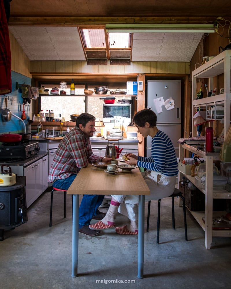 Maigo Mika and Jesse, two Canadians sitting at a table in a traditional Japanese akiya house.