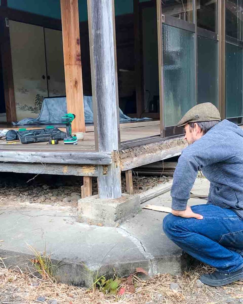 man fixing Japanese engawa beam during Japanese House Renovation
