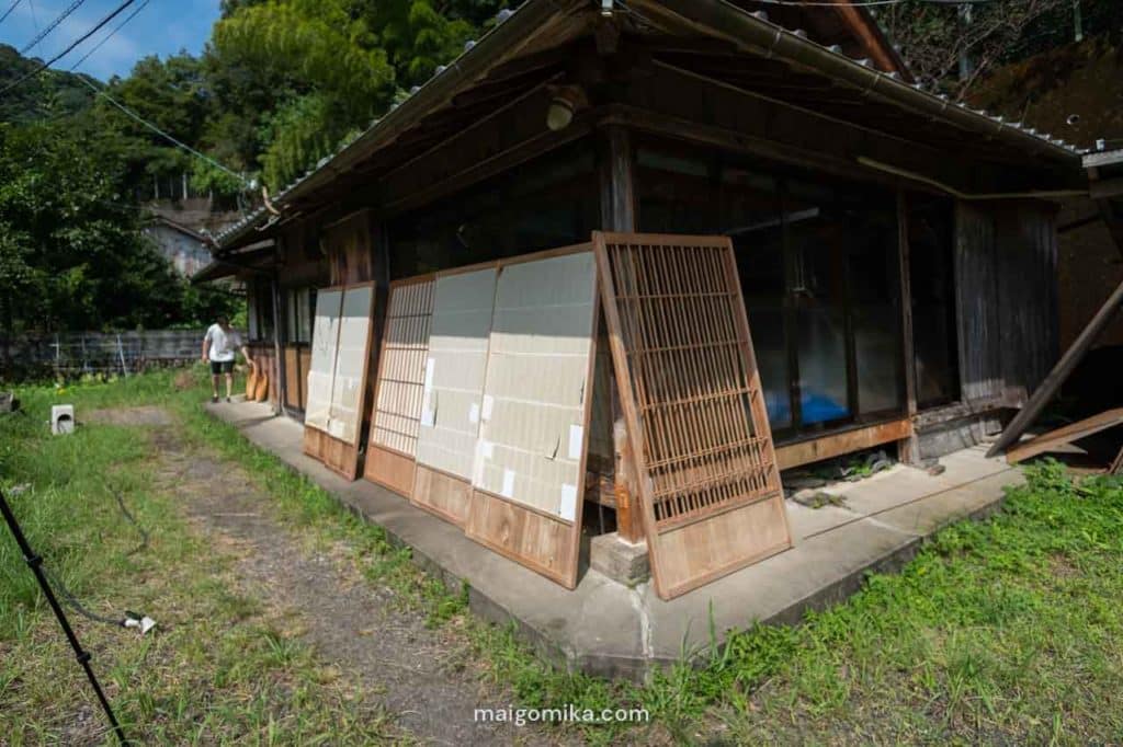 old shoji screen doors propped on side of akiya house in Japan during Japanese House Renovation