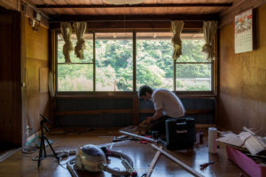 renovation process with man in Japanese house in the countryside