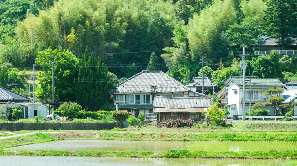 two story traditional Japanese house with hole in the roofline
