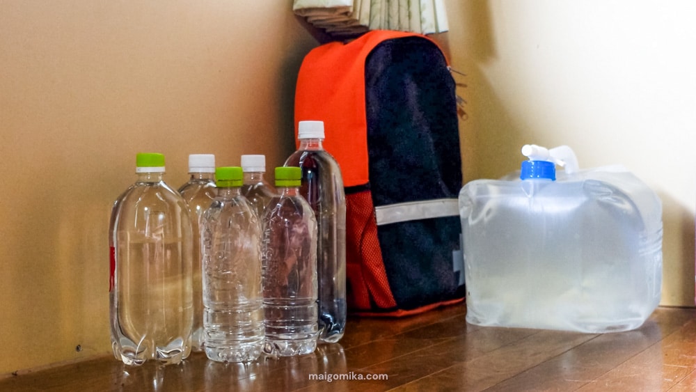 water bottles and emergency bag for typhoon preparation in Japan