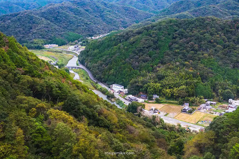 Rural Japan with mountains and a road running through it