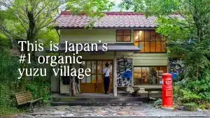 woman walking into Umaji shop, famous for yuzu products
